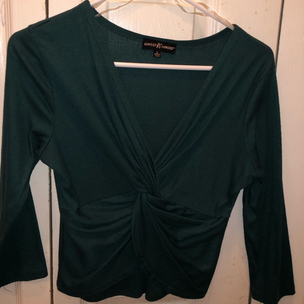 Dark green shirt, knot in front